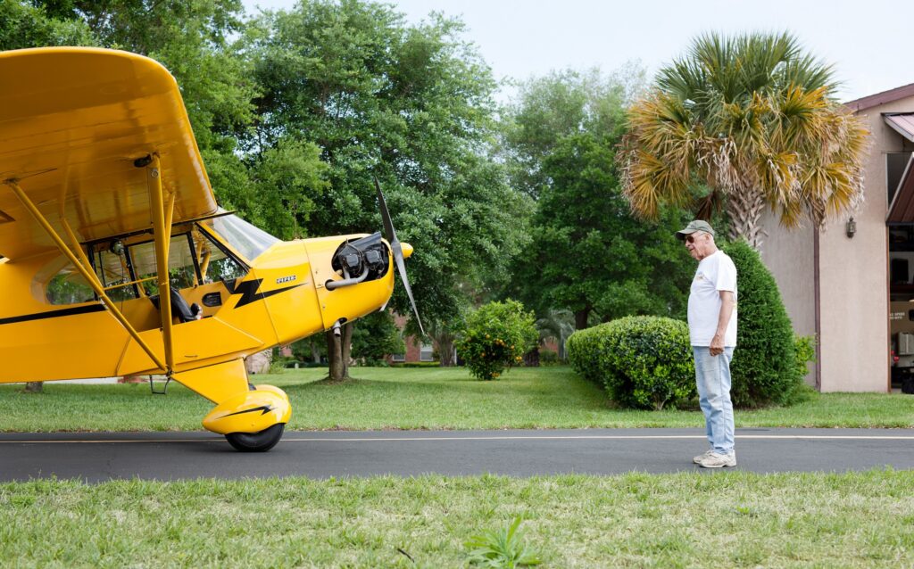 A story about Spruce Creek Fly-In Community in Florida: Portraits of residents and pilots with their planes.