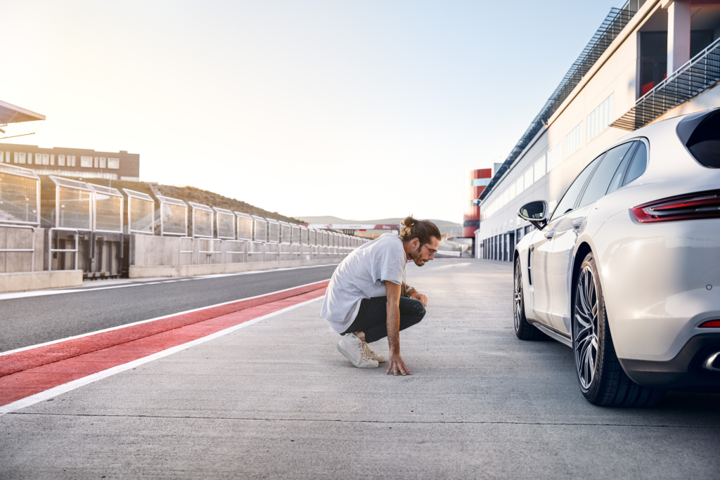 Porsche Panamera E-Hybrid and Composer Jimek on a racetrack