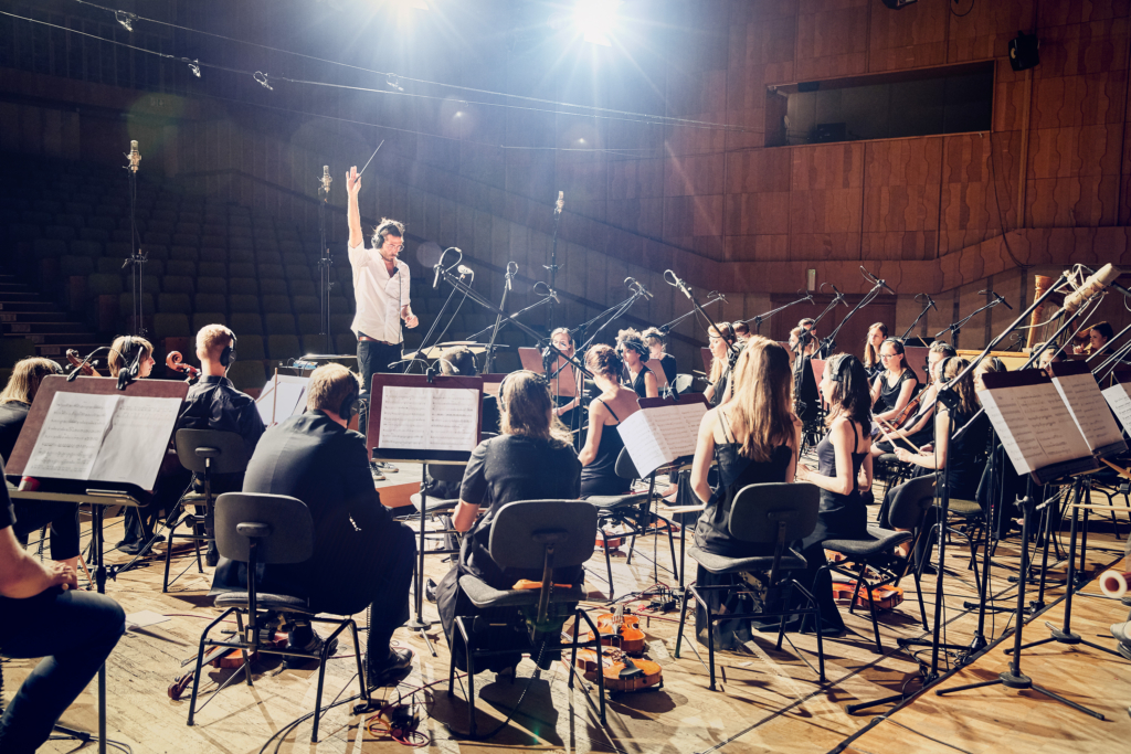 Composer and Musician Jimek with his orchestra