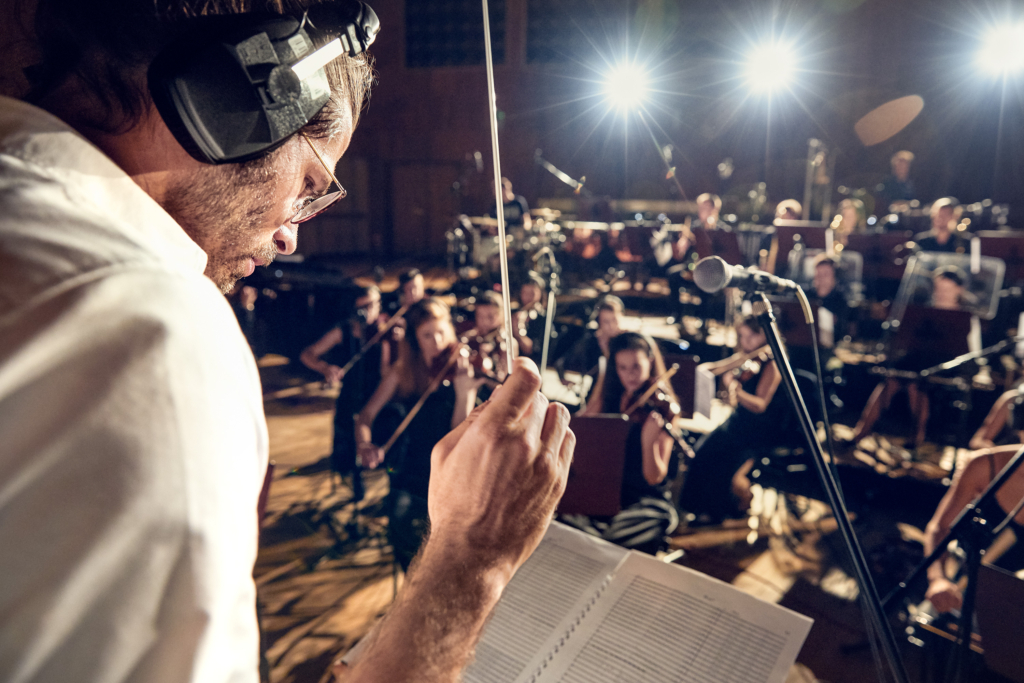 Composer and Musician Jimek with his orchestra