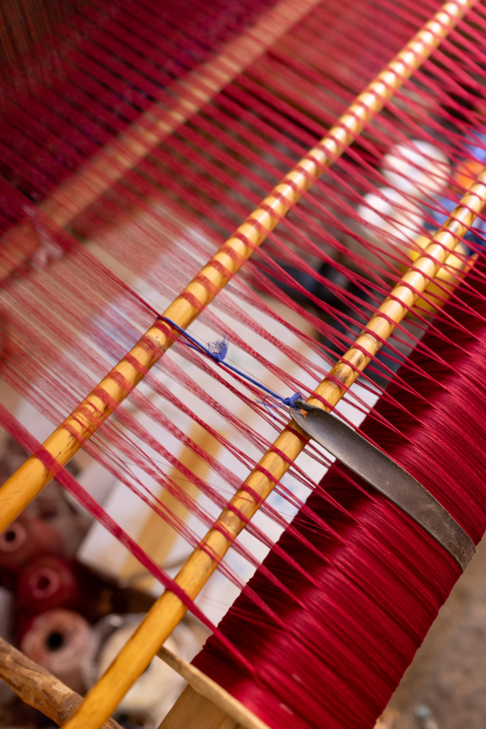 Fez, Morocco, has a long tradition of arts and crafts. I visited and photographed artisans from a variety of fields in their workshops. Weaver at a traditional loom.