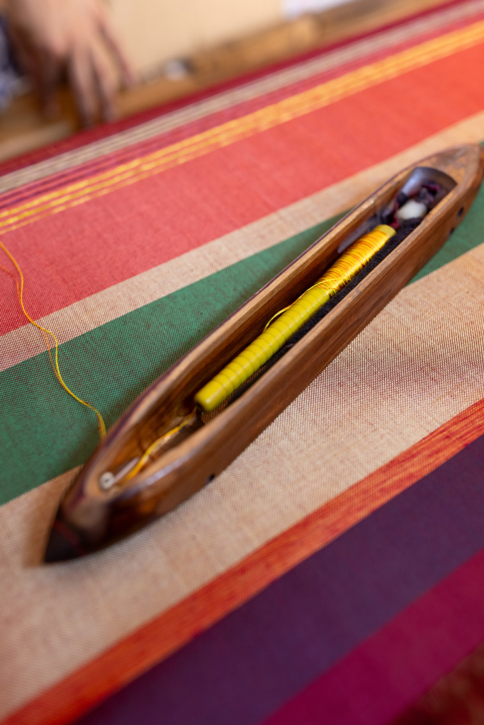 Fez, Morocco, has a long tradition of arts and crafts. I visited and photographed artisans from a variety of fields in their workshops. Weaver at a traditional loom.