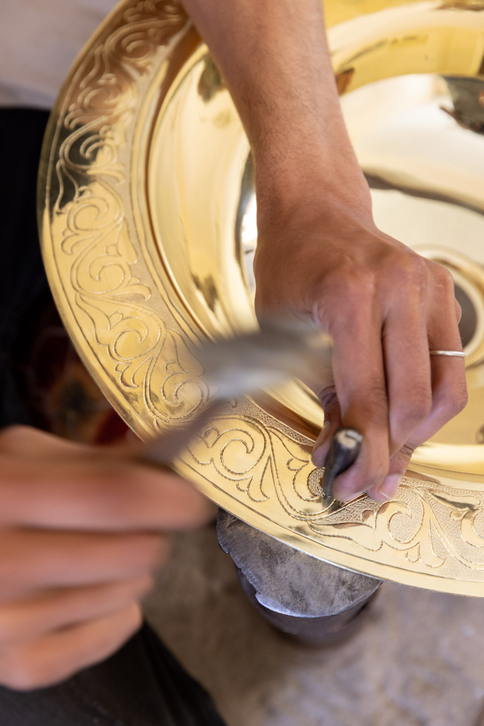Fez, Morocco, has a long tradition of arts and crafts. I visited and photographed artisans from a variety of fields in their workshops. Metal-worker.