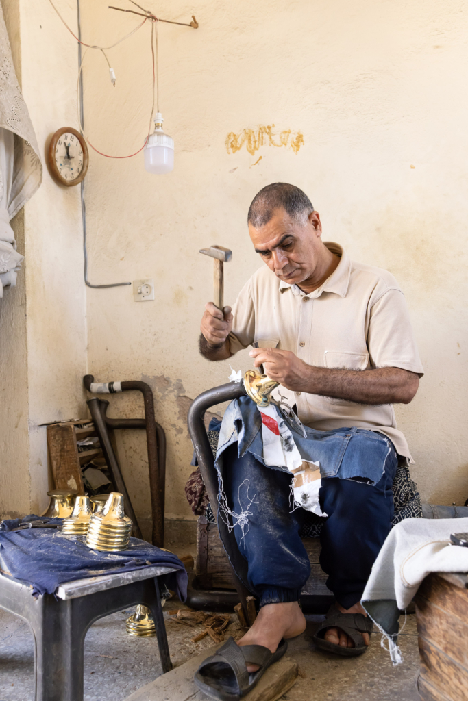 Metal-worker. Fez, Morocco, has a long tradition of arts and crafts. I visited and photographed artisans from a variety of fields in their workshops.