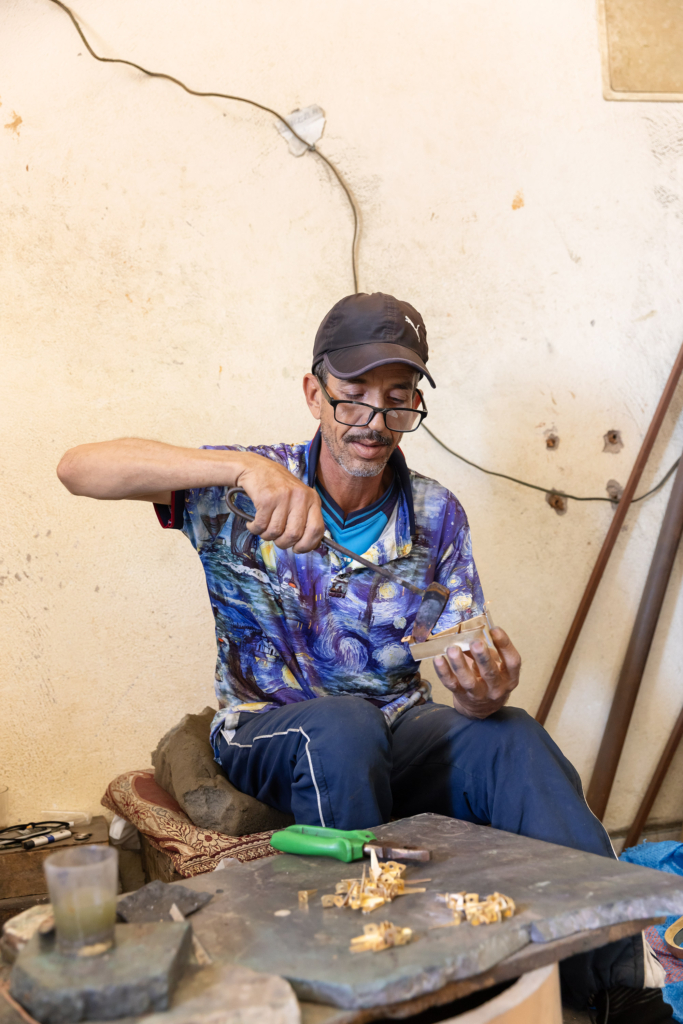 Fez, Morocco, has a long tradition of arts and crafts. I visited and photographed artisans from a variety of fields in their workshops. Metal-worker.